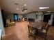 Open concept living room area with lots of seating, hardwood floors and great lighting at 2033 Aaron Pl, Clearwater, FL 33760