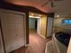 Bedroom featuring a large jacuzzi tub, ceilings with wood beams, and large closet space at 2033 Aaron Pl, Clearwater, FL 33760