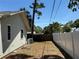 Exterior side yard with privacy fence and room for outdoor activities at 2033 Aaron Pl, Clearwater, FL 33760