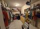 Spacious walk-in closet with shelves, hanging rods, mirror and ample storage at 2033 Aaron Pl, Clearwater, FL 33760