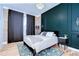 Stylish bedroom featuring paneled walls, modern decor and a chandelier at 215 Central Ave # 2B, St Petersburg, FL 33701