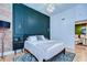Beautiful bedroom with green paneled wall and decorative accents at 215 Central Ave # 2B, St Petersburg, FL 33701