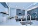 Well-appointed kitchen featuring stone backsplash and stainless steel appliances at 215 Central Ave # 2B, St Petersburg, FL 33701