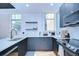 Bright kitchen features modern appliances and sleek countertops, with natural light at 215 Central Ave # 2B, St Petersburg, FL 33701