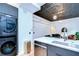 Bright kitchen features modern appliances, an eat-in island, and unique ceiling details at 215 Central Ave # 2B, St Petersburg, FL 33701