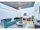 A spacious living room features sleek decor, a plush sofa, and hardwood floors at 215 Central Ave # 2B, St Petersburg, FL 33701