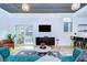Open-concept living room with modern decor and access to balcony at 215 Central Ave # 2B, St Petersburg, FL 33701