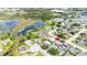 An aerial view of a home in a neighborhood near a lake at 21608 Wytheville Way, Lutz, FL 33549