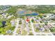 An aerial view of a home in a neighborhood near a lake at 21608 Wytheville Way, Lutz, FL 33549