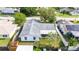 Aerial view of the house with yard and the surrounding neighborhood at 21608 Wytheville Way, Lutz, FL 33549