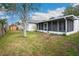 Fenced backyard and enclosed patio add to the appeal of the home's outdoor space at 21608 Wytheville Way, Lutz, FL 33549