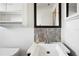 Close up of a bright bathroom featuring a dark vanity at 21608 Wytheville Way, Lutz, FL 33549