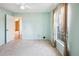 Light-green bedroom with a window and neutral carpet at 21608 Wytheville Way, Lutz, FL 33549