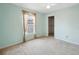 Light-green bedroom with a window, closet, and neutral carpet at 21608 Wytheville Way, Lutz, FL 33549