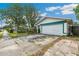 Charming single Gathering home with a two car garage, mature trees, and manicured landscaping at 21608 Wytheville Way, Lutz, FL 33549