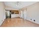 Bright living room featuring hardwood floors and connecting to an open kitchen concept at 21608 Wytheville Way, Lutz, FL 33549