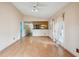 Bright living room featuring hardwood floors and connecting to an open kitchen concept at 21608 Wytheville Way, Lutz, FL 33549