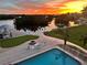 This backyard with pool, lounge furniture, and manicured lawn, is the perfect outdoor oasis at 24197 Treasure Island Blvd., Punta Gorda, FL 33955