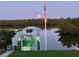 This backyard boasts a private dock with boat lift, mature landscaping, and direct access to the water at 24197 Treasure Island Blvd., Punta Gorda, FL 33955