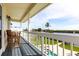 Relaxing balcony seating offers scenic views of the waterfront and tropical surroundings at 24197 Treasure Island Blvd., Punta Gorda, FL 33955