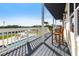 Balcony overlooking the canal and in-ground pool includes outdoor seating at 24197 Treasure Island Blvd., Punta Gorda, FL 33955