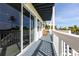Balcony offers a view of a canal, palm trees, and is equipped with seating at 24197 Treasure Island Blvd., Punta Gorda, FL 33955