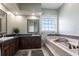 Relaxing bathroom with a soaking tub and dual vanities, perfect for unwinding at 24197 Treasure Island Blvd., Punta Gorda, FL 33955