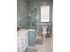 Beautiful bathroom featuring a glass shower, white vanity, and stylish fixtures at 24197 Treasure Island Blvd., Punta Gorda, FL 33955