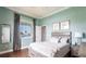 Cozy bedroom with a queen bed, decorative curtains, and neutral tones at 24197 Treasure Island Blvd., Punta Gorda, FL 33955