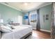 Bright bedroom with a plush bed, hardwood floors, and a scenic view at 24197 Treasure Island Blvd., Punta Gorda, FL 33955