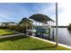 Exterior view of a covered boat lift and dock on the water at 24197 Treasure Island Blvd., Punta Gorda, FL 33955