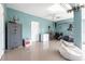 Spacious garage with fishing gear storage, a safe, and a white beanbag chair at 24197 Treasure Island Blvd., Punta Gorda, FL 33955