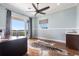 Large home office with hardwood floors, balcony access, and a convenient wet bar area at 24197 Treasure Island Blvd., Punta Gorda, FL 33955