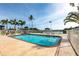 Outdoor swimming pool with a view of the surrounding river in a tropical setting at 24197 Treasure Island Blvd., Punta Gorda, FL 33955