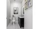 Clean, elegant powder room with stylish decor and modern fixtures at 24197 Treasure Island Blvd., Punta Gorda, FL 33955