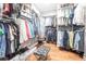 Organized walk-in closet with ample storage and a stylish center bench at 24197 Treasure Island Blvd., Punta Gorda, FL 33955