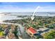 Stunning aerial view of waterfront property with canal access to the Gulf of Mexico and beautiful neighborhood setting at 2479 Trade Winds Dr, Dunedin, FL 34698