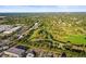 Scenic aerial view of the community near a golf course and green landscape at 2479 Trade Winds Dr, Dunedin, FL 34698