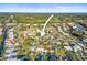Aerial view showing the home's location in a vibrant residential neighborhood at 2479 Trade Winds Dr, Dunedin, FL 34698