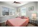 Comfortable bedroom with ample natural light and well-designed accents at 2479 Trade Winds Dr, Dunedin, FL 34698