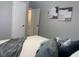 Bright bedroom featuring modern decor, comfortable bedding, and an open doorway at 2709 S Manhattan Ave, Tampa, FL 33629