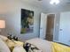 Bedroom with floral painting and wood look flooring at 2709 S Manhattan Ave, Tampa, FL 33629