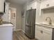 Well-equipped kitchen featuring stainless steel appliances, white cabinetry, and modern fixtures at 2709 S Manhattan Ave, Tampa, FL 33629