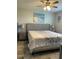 Spacious bedroom with a king-sized bed, nightstands, and coastal-inspired artwork at 2714 60Th Avenue W Ter # 12D, Bradenton, FL 34207