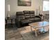 Cozy living room with a reclining sofa, lamps, and a stylish coffee table at 2714 60Th Avenue W Ter # 12D, Bradenton, FL 34207