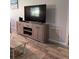 Inviting living room with stylish TV console and laminate flooring, perfect for relaxing at 2714 60Th Avenue W Ter # 12D, Bradenton, FL 34207