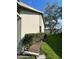 Lush side yard with healthy foliage and partial view of surrounding fence at 2714 60Th Avenue W Ter # 12D, Bradenton, FL 34207