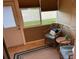 Bright sunroom featuring tile flooring, wicker furniture, and natural light through large windows at 2714 60Th Avenue W Ter # 12D, Bradenton, FL 34207