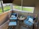 Cozy sunroom with wicker seating, throw pillows and plenty of natural light at 2714 60Th Avenue W Ter # 12D, Bradenton, FL 34207
