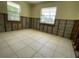 Awaits restoration: Bedroom with tile floor, exposed framing, offering a blank canvas for customization at 3207 S De Bazan Ave, St Pete Beach, FL 33706